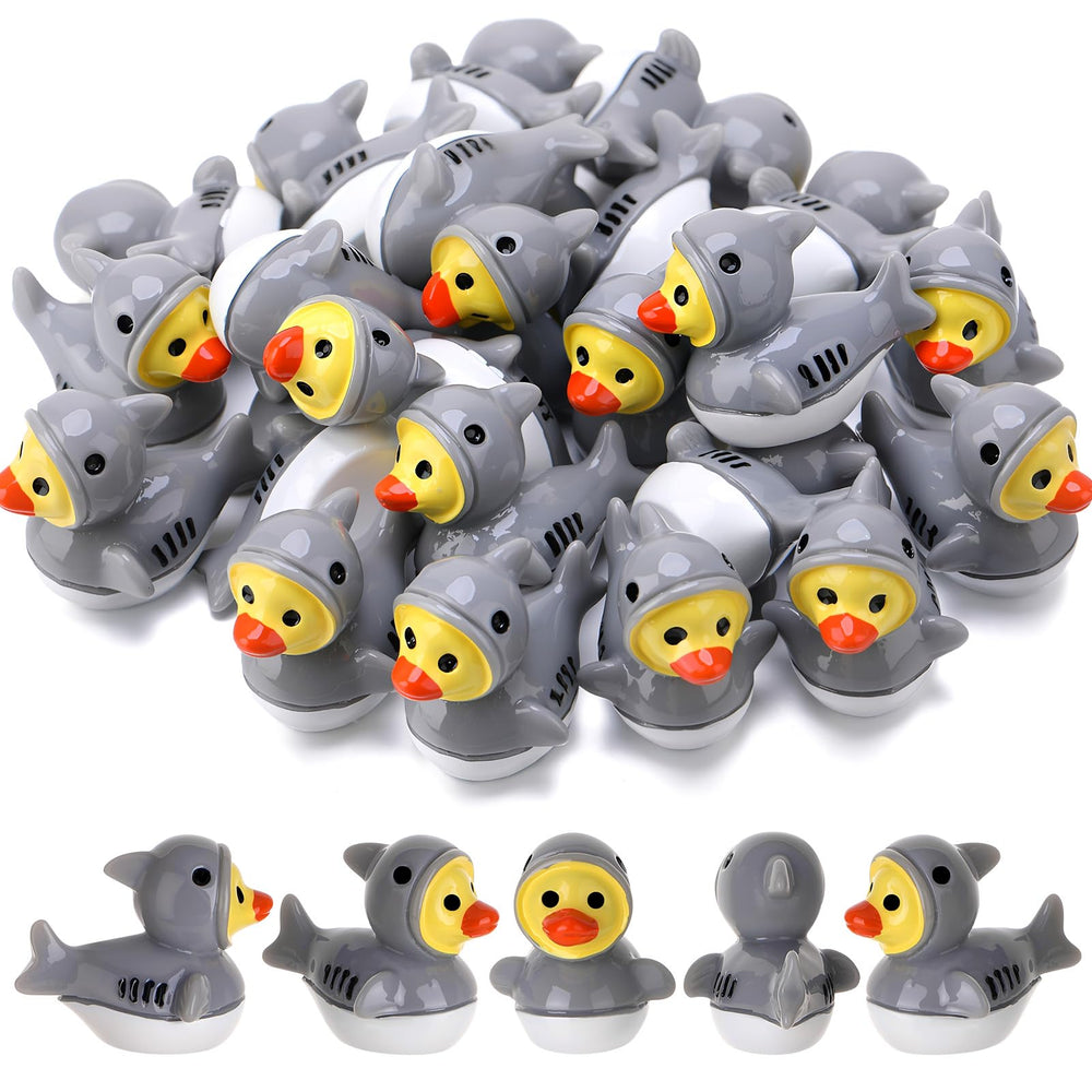 30 mini shark resin ducks in a decorative arrangement