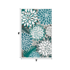 Arenarug Outdoor Rug 5' x 8' teal floral pattern on patio
