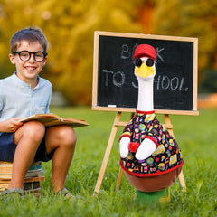 Back to school themed goose decor set on a patio