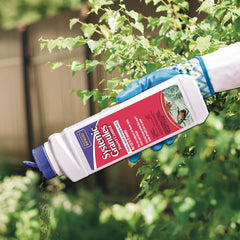 Bonide Systemic Insect Control Granules being applied to garden soil