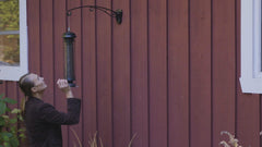 Brome Squirrel Solution 150 Bird Feeder seed ports close-up