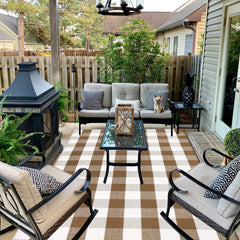 CAINANEL Buffalo Plaid Outdoor Rug displayed in an entryway setting