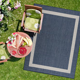CAMILSON Outdoor Rug 8x10 blue and white bordered design front view