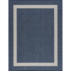 CAMILSON Outdoor Rug displayed on patio setting
