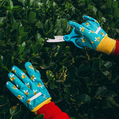 Children wearing PROMEDIX P Kids Garden Gloves in the garden