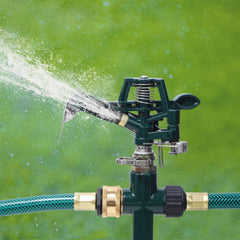 Close-up of Biswing impact sprinkler head showing adjustable nozzle