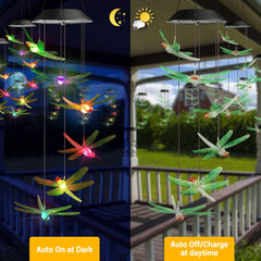 Close-up of dragonfly design on solar wind chimes