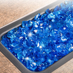 Close-up of GASPRO turquoise fire glass in a fire pit