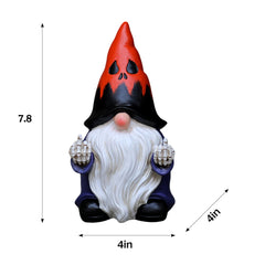 Close-up of Halloween gnome's skeleton hands