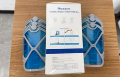 Close-up of Husaco insect trap cartridge in blue