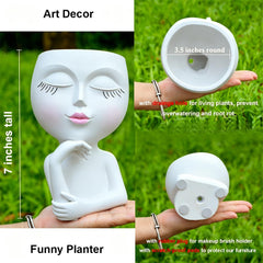 Close-up of LovTocTic Thinking Face Planter showing drainage hole