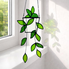 Close-up of Royxen stained glass suncatcher showing vibrant green leaves