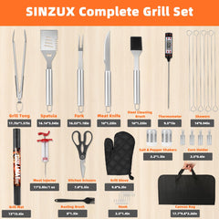 Close-up of SINZUX stainless steel grilling tools including spatula and tongs