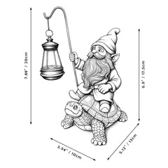 Close-up of solar-powered LED lantern on gnome statue