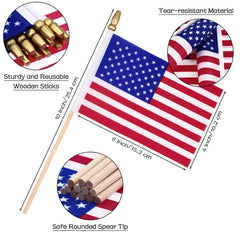 Close-up of Tegeme American flags showing golden spear tops