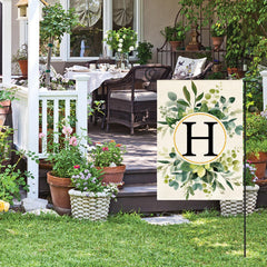 Close-up of the floral design on AVOIN Monogram H Garden Flag