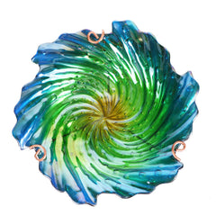 Close-up of the handmade glass bowl of the bird bath