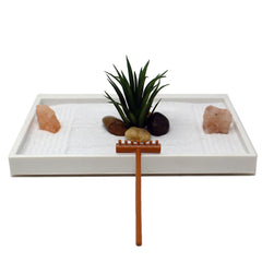 Close-up of the rake and river rocks in the Mini Zen Garden