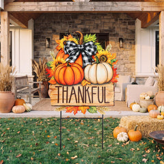 Close-up of the Thankful script on the pumpkin yard sign