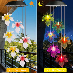 Close-up of Toodour solar wind chimes showing detailed maple leaf design
