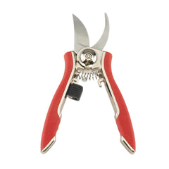 Dramm pruning shears on a garden table surrounded by tools