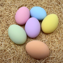 Eggcetera ceramic nest eggs displayed in a decorative basket