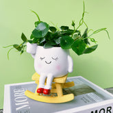 EylbKey Cute Rocking Chair Head Planter front view, white resin
