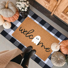 Fallovea doormat on a porch with autumn decorations