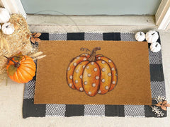 FGSS Pumpkin Doormat displayed on a porch