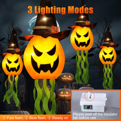 Four Cuorung Halloween pumpkin witch hats hanging in a garden