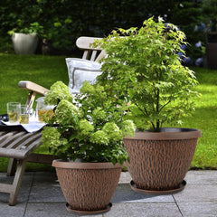 Four Nooulap plant pots arranged on a balcony