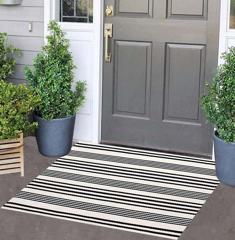 Front view of BUAGETUP Black and White Striped Doormat 24" x 35"