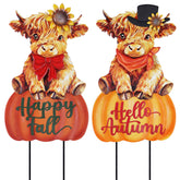 Front view of hogardeck Highland Cow Garden Stakes with pumpkins