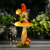 Front view of HONGLAND Solar Garden Gnome Figurine on mushroom
