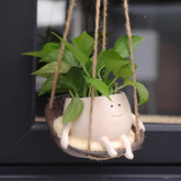 Front view of NINIPAPA Hanging Swing Chair Planter with smile face design
