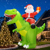 Front view of zukakii 9x8FT Christmas inflatable Santa riding a dinosaur