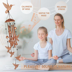 GDNSFIT Hummingbird Wind Chimes hanging outdoors in a garden