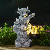 Goodeco Highland Cow Garden Statue front view with solar lantern