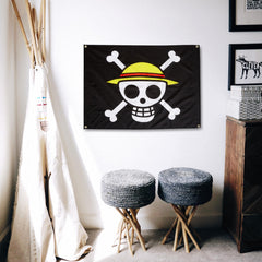 Great Eastern One Piece Luffy Pirate Flag displayed in a garden setting