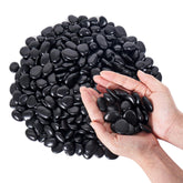 GreatBuddy Black Pebbles 1-2 inch size in a garden setting