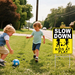 GXGGUS double-sided Slow Down Kids At Play sign outdoors