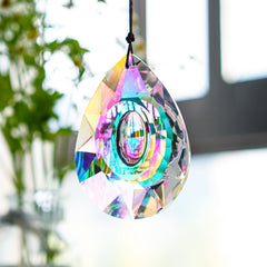 H&D rainbow suncatcher hanging in a window