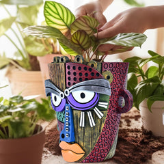 Hand-painted Midogaigai planter showcasing abstract face design