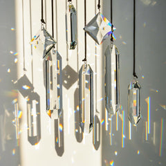 HDCRYSTALGIFTS Suncatchers hanging in a window with sunlight
