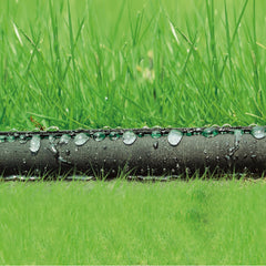 Hourleey soaker hose laid out in garden bed