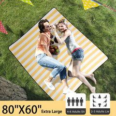 HX&OD picnic blanket spread out on grass