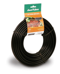 Installation of Rain Bird tubing in a garden bed