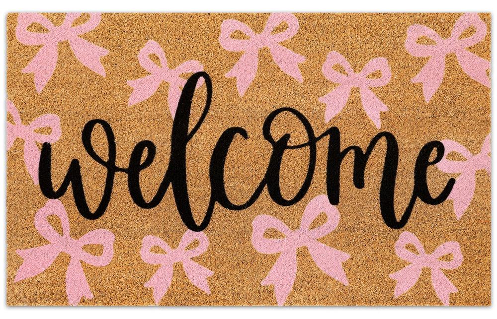 JarThenaAMCS Pink Bow Coir Door Mat front view with welcome text