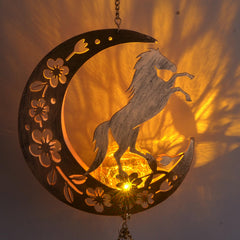 JOBOSI Moon Horse Wind Chime hanging in a garden
