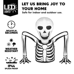 Joiedomi inflatable skeleton in a yard with Halloween decor